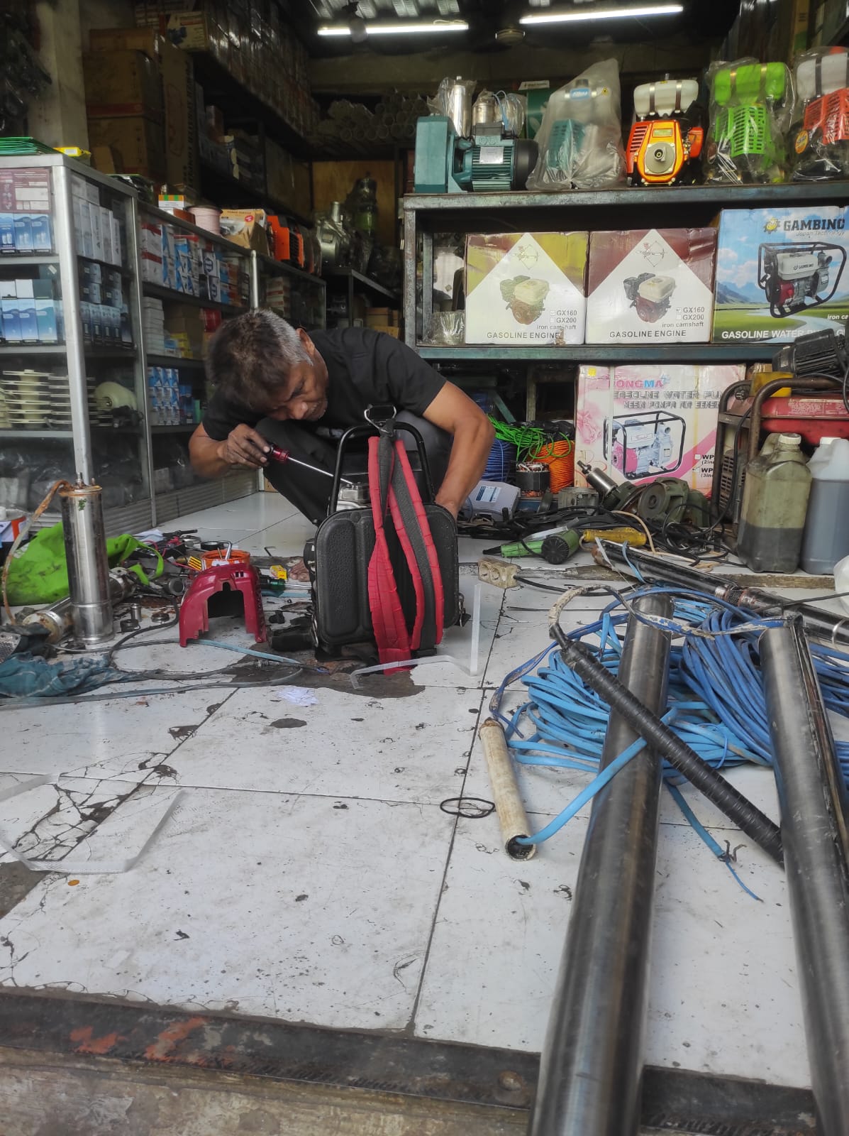 Pekerjaan Perbaikan Mesin Pompa Air